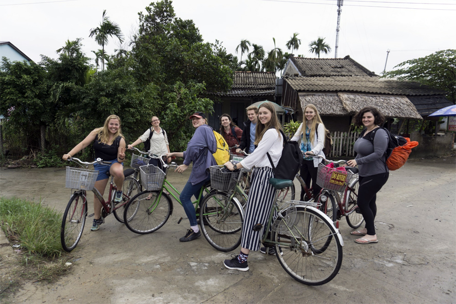 Health and medicine students riding bicycles in Vietname