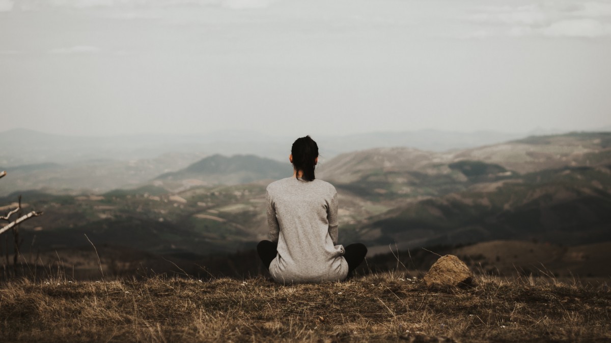 Woman meditating outdoors