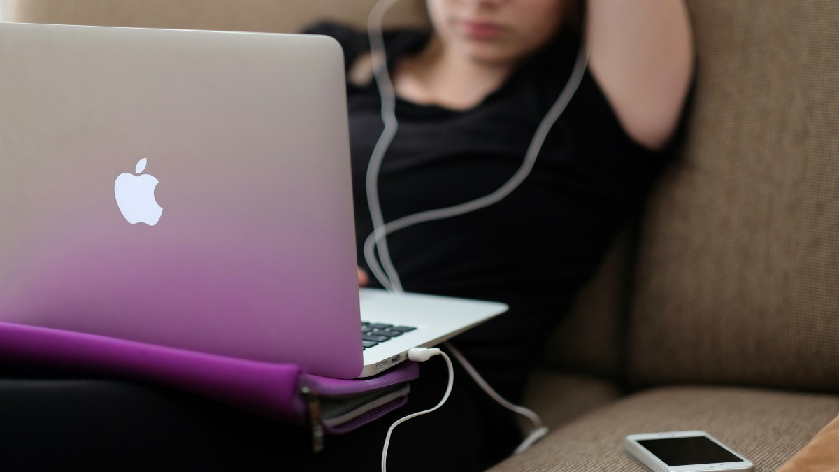 graphic of person sitting at a computer with title for uni virtual clinic