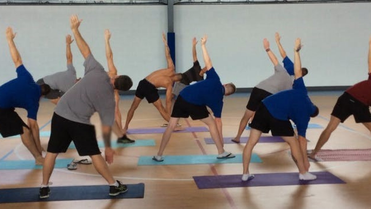 Program participants doing yoga in the Alexander Maconochie Centre