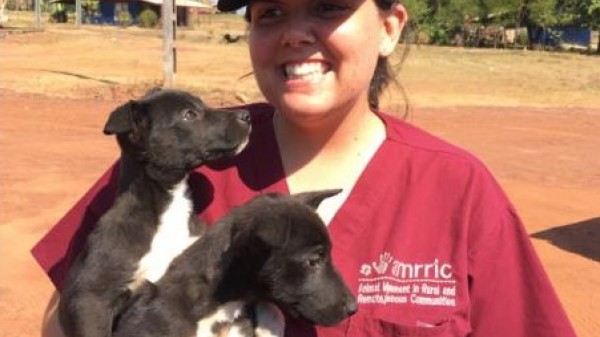 Tamara Riley holding two dogs in her hands